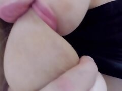 Big lips pussy cam model is licking and sucking her big tits